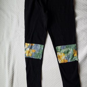 Black leggings with applique knee patches